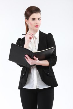 İş kadını bir defter ve kalem ile