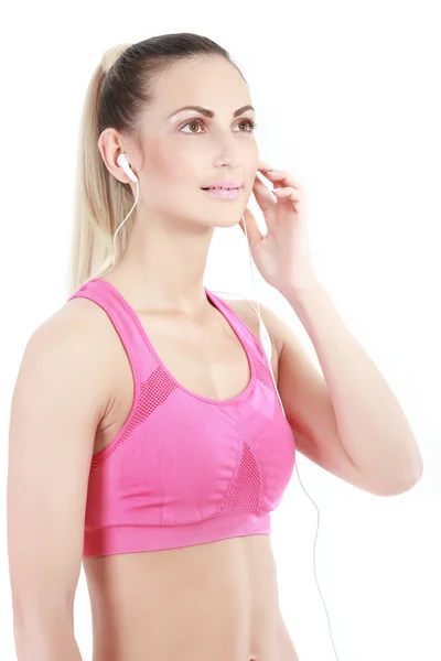 Fitness-Frau im Sportstil vor weißem Hintergrund. — Stockfoto