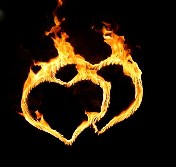 Helles Flammensymbol auf schwarzem Hintergrund — Stockfoto