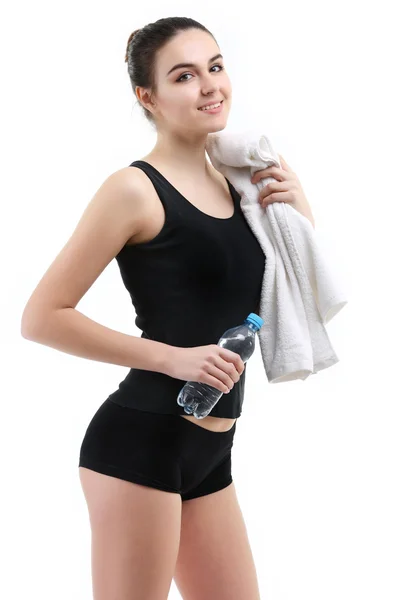 Junge gesunde Fitness-Frau mit Handtuch und Wasser — Stockfoto