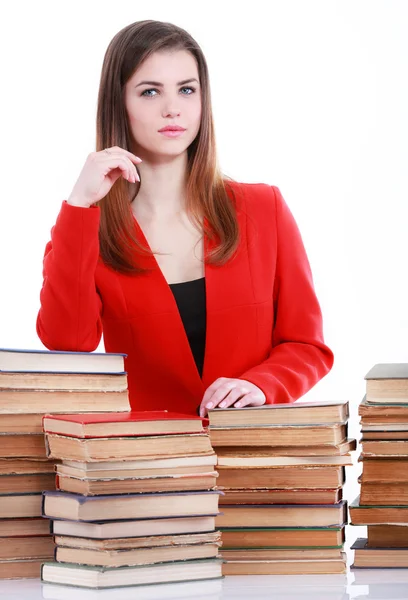 たくさんの本と赤いスーツの若い学生女性 — ストック写真