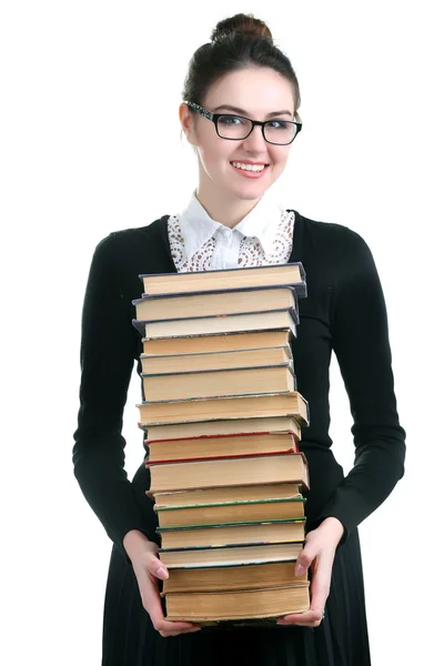 Mujer joven con libros de pila aislado en blanco — Foto de Stock
