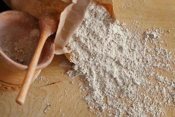 Almond flour pile from top on wooden background