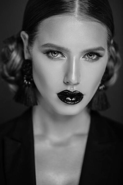 Beautiful woman with make up posing on studio