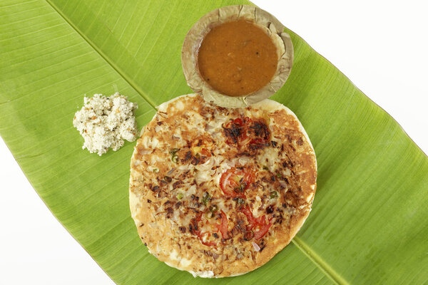 Uttapam, Traditional South Indian Breakfast with sambar and coconut chutney.