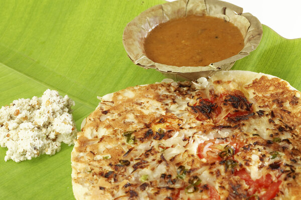 Uttapam, Traditional South Indian Breakfast with sambar and coconut chutney.