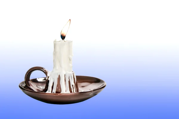 Candle in candlestick brown — Stock Photo, Image