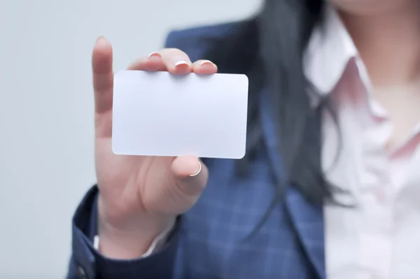 woman holding paper bussiness card