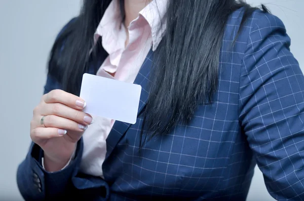 woman holding and showing bussiness card