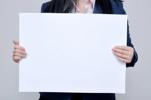 woman showing white sign