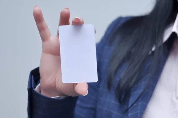 woman holding bussiness card