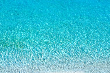 Turkuaz deniz dalgaları, doku, arka plan. Yukarıdan görüntüle.