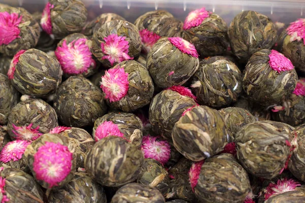 Flowering traditional chinese bound green tea in the bazaar, selective fokus.