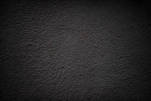 Siyah grunge arkaplan ve vignette. Alçı yüzey dokusu.