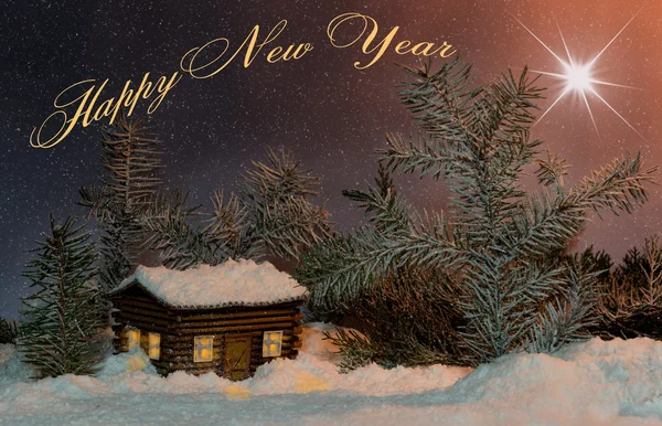 Estrella de Navidad sobre la casa en la nieve y abetos. Concepto de vacaciones para Año Nuevo con inscripción en inglés —  Fotos de Stock