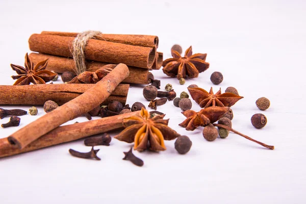 Composition of spices from cinnamon and an anise — Stock Photo, Image