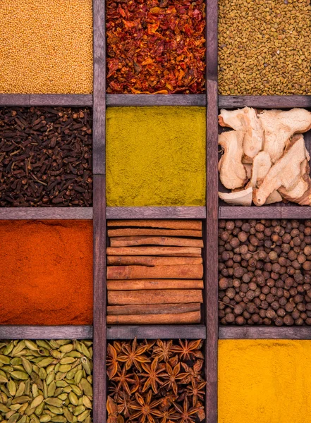 Spicy spices in a wooden box — Stock Photo, Image