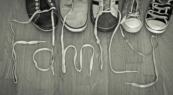 Family footwear and inscription — Stock Photo, Image