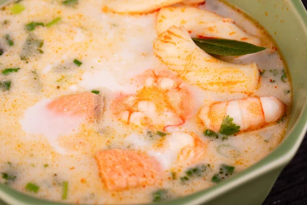 coconut milk soup with seafood and lime leaves