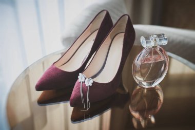 Wedding set of the bride. Wine red shoes, perfume. Bridal accessories. 