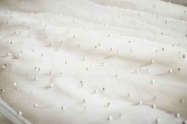 Gelinliğin dokusu. Gelinlik Detayları. Görüntüyü kapat.