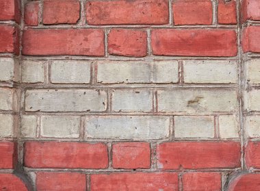 Red and white brick pattern. Old brick wall with cracks and scratches. Brickwall detail for background, texture. Vintage fence.
