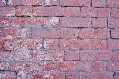 Eski bir kırmızı tuğla duvarın dokusu. Yakın çekim, desen.