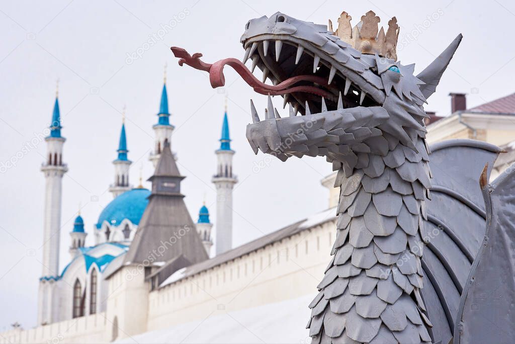 Symbols of the city of Kazan: a dragon named Zilant in a golden crown and the Kul Sharif mosque. Close-up.