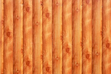 Güzel, pürüzsüz, turuncu ahşap arka plan. Çitin bir parçası. Yakın plan..