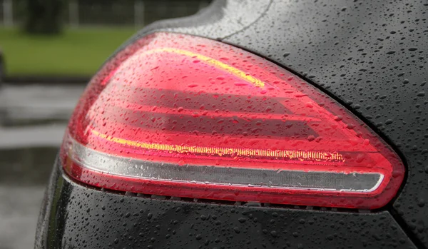 Water drops on car backlights after rain