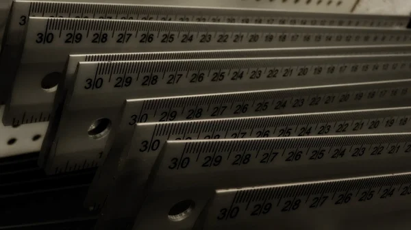 Aluminium centimeter rulers on the showcase at hardware store — Stock Photo, Image