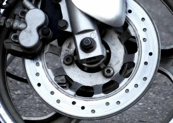 Motorcycle worn disc and caliper of hydraulic brake system — Stock Photo, Image