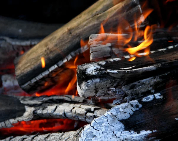 Firewood burning in flame macro shot stock photo — Stock Photo, Image