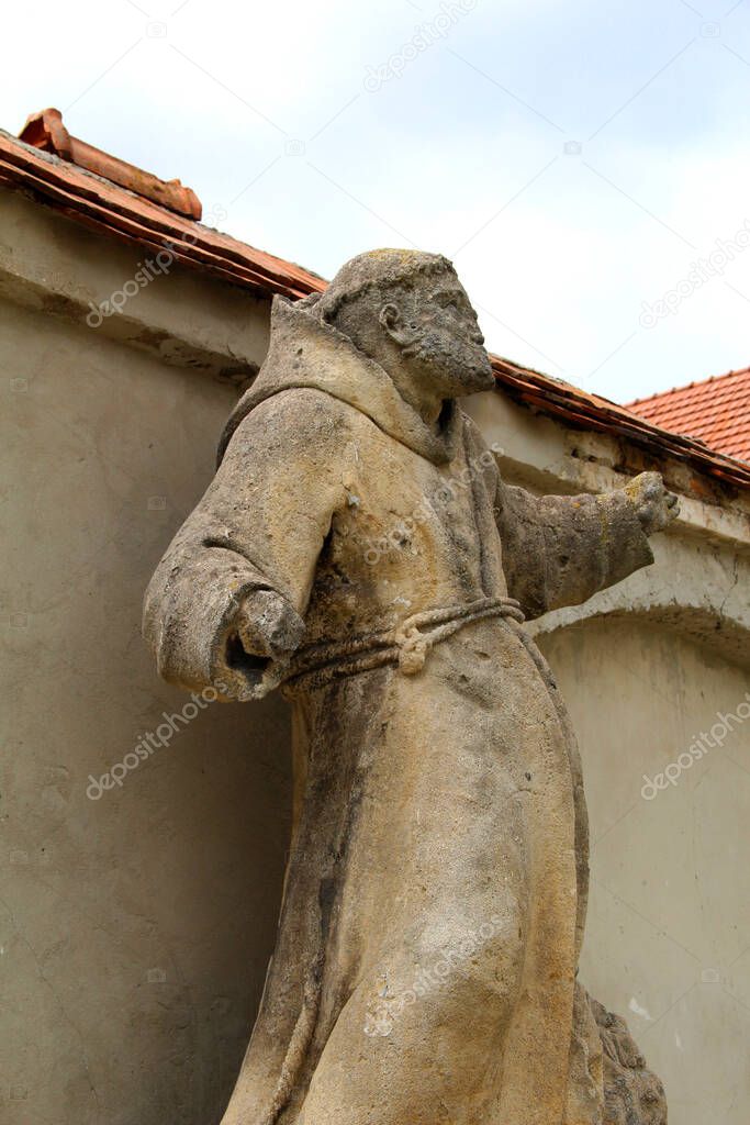 Old Sculpture Of Monk Made Of Stone 