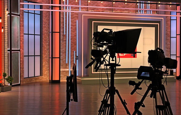 Special equipment for recording and broadcasting television programs in a stylized studio. Camcorders and electronic devices for video production 