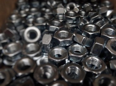 Metal eşya ürünleri. Altıgen somun arka plan doku