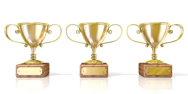 Three golden cup trophies — Stock Photo, Image