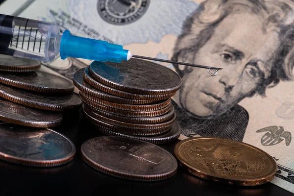 Disposable Syringe with Drop on the Point of a Needle, American Coins and 20 American Dollar Bill
