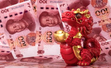 Sembolik bir Çin ejderhası figürü. Bilgelik, güç, uzun yaşam ve güç sembolü. 100 Çin yuan banknotunun arka planına karşı iyi şans ve refah getiriyor..