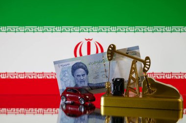 İran bayrağının arka planında minyatür bir yağ pompası