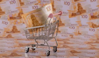 Minyatür bir süpermarket arabası ve 100 Rus rublesi.