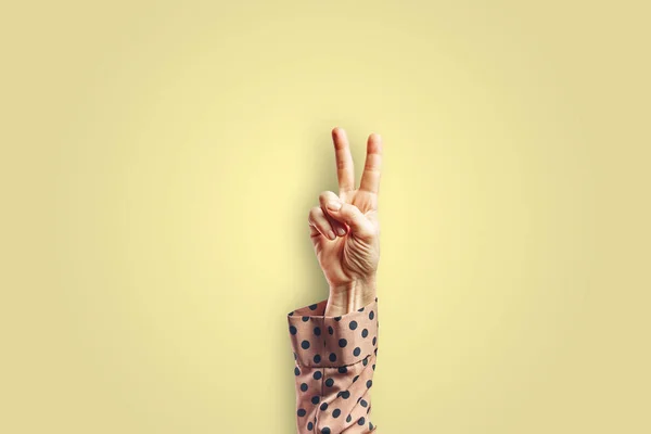 Woman Arm Making Victory Gesture Hand Isolated Yellow Background Gesture — Stock Photo, Image