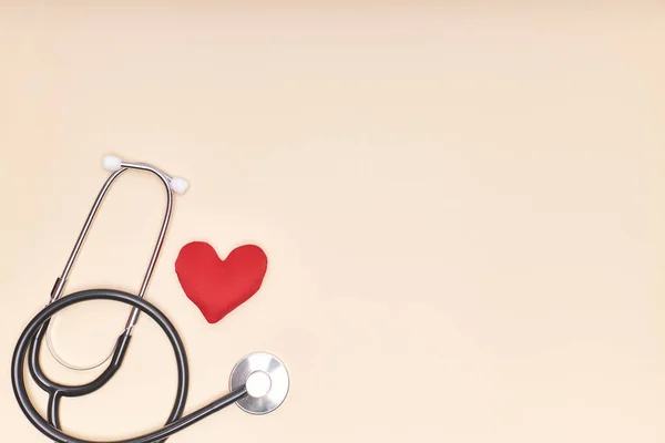 Stethoscope with a red heart. Health and care concept