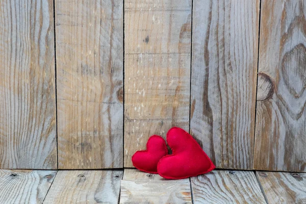Two red hearts on a wooden background for Valentine's Day — Zdjęcie stockowe