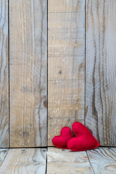 Two red hearts on a wooden background for Valentine's Day — Zdjęcie stockowe