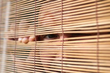eyes looking through the blinds clipart