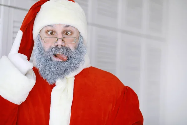 Portrait real happy Santa Claus.Funny Santa. Theme Christmas holidays and winter new year Christmas are coming!