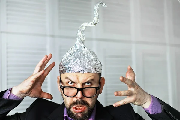 Tin Foil Hat Isolated on White Background, Symbol for Conspiracy
