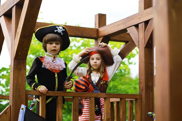 Children\'s party in pirate style. Children in pirate costumes are playing on Halloween.