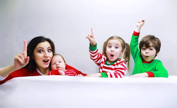 Family Striped Pajamas Resting Home Little Children Dressed Elves Lying — Stock Photo, Image